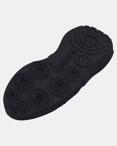 the sole of a black shoe with circles on it's outstep and bottom part