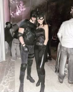 two people dressed up as batman and catwoman