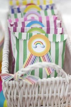 some colorful bags sitting in a white basket