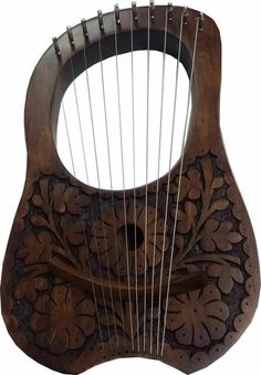 an ornately carved wooden instrument with strings