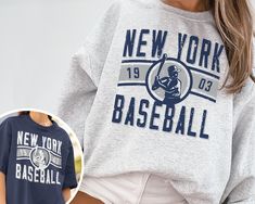 "WELCOME TO MY STORE ♥️ _This Vintage New York Yankee EST 1903 Sweatshirt / T-Shirt, Yankees Crewneck Sweatshirt, New York Baseball Shirt, Retro Yankees Shirt, NY Shirt, New York Sweater, Yankees Sweater, Yankees Sweatshirt, World Series, NY Game Day Shirt, NY Baseball, Vintage Baseball Tee, Yankees Fan Gift, Gift for her, Gift for Mom, Gift for him, Baseball Season, Retro New York. _Please check Color and Size Charts before placing the order. You can find them in the listing's photos (Depending Relaxed Fit Crew T-shirt With Lettering, Sports Season Crew Neck T-shirt With Lettering, Sports Season Lettering Crew Neck T-shirt, Baseball Season Streetwear T-shirt With Lettering, Relaxed Fit Short Sleeve Fan Apparel Sweatshirt, Relaxed Fit Slogan Sweatshirt With Short Sleeves, Relaxed Fit Short Sleeve Slogan Sweatshirt, Fan Apparel Short Sleeve Graphic Sweatshirt, Sporty T-shirt With Lettering And Crew Neck