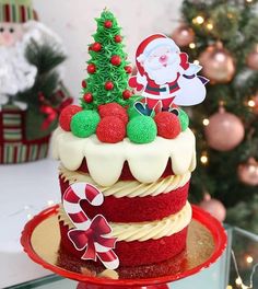 a decorated christmas cake on a red plate