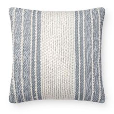 a blue and white striped pillow on a white background