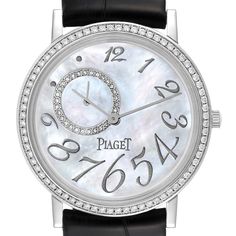 Piaget Altiplano Mother Of Pearl White Gold Diamond Mens Watch GOA31106. Manual winding movement. 18K white gold case 34.0 mm in diameter. Snap-on caseback. 18k white gold bezel set with original Piaget factory diamonds. Scratch resistant sapphire crystal. Mother of pearl dial with raised white gold Arabic numerals. Small seconds sub-dial between 9 and 12. Black leather strap with 18k white gold tang buckle. Round Diamond Watch With Diamond Hour Markers For Business, White Gold Diamond Watch With Skeleton Dial, Business Diamond Watch With Round Shape, Business Diamond Watch With Round Face, Business Diamond Watch With Hour Markers, Anniversary White Gold Watches With Skeleton Dial, White Diamond Chronometer Watch, White Diamond Watch With Chronometer, Classic Round Diamond Watch With Skeleton Dial