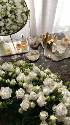 a table topped with lots of white flowers