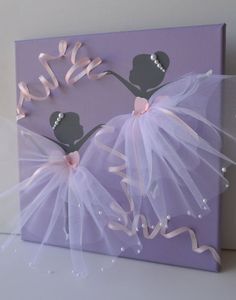 a purple canvas with two ballerinas on it