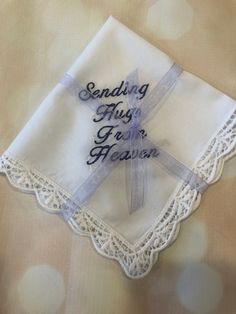 "This Handkerchief is embroidered in White, silver, gold or black. It says, \"Sending Hugs From Heaven\". You pick which handkerchief you want. 1,2 or 3. You may add a name and date to the opposite corner if you like, to document a funeral.. You also select the color of the thread to be used." Personalized Handkerchief, Personalized Handkerchiefs, Sending Hugs, Celebration Of Life, White Silver, Basement, Silver Gold, Thread, Sewing