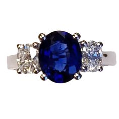 an oval blue sapphire and diamond ring