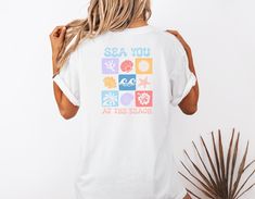 Add some coastal charm to your wardrobe with our See You At The Beach T-Shirt! This retro beachy style top is perfect for all your seaside adventures, featuring a fun and vibrant design printed on the back. Whether you're strolling along the shore or simply craving a little Vitamin Sea, this t-shirt is sure to make a splash wherever you go. Embrace the laid-back vibes of the beach and showcase your love for all things ocean-inspired with this must-have tee! 🖤 Comfort Colors introduces the "Comf Summer Crewneck, Beachy Style, Beach T Shirt, Beach T Shirts, Summer Tee, Ocean Inspiration, Crew Neck Shirt, Style Shirt, Ocean Beach