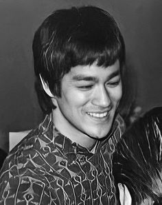 black and white photograph of young man smiling