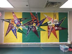 a bulletin board decorated with flags and banners