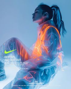 a woman sitting on the ground with her legs spread out and glowing in neon light