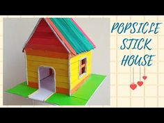 a paper house with the words popsicle stick house