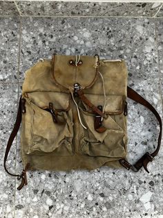 Very Old Genuine Military Bag Haversack Backpack Vintage Canvas Army Canvas Leather Straps Unisex 1970 Haversack Vintage Canvas Army Size 41 Centimetres (16 inches) / 40 Centimetres (16 inches) Bag Strong Durable military canvas For professional use  One size fits all Unisex Check photos for condition Practical Khaki Backpack, Khaki School Bag With Multiple Pockets, School Shoulder Duffle Bag With Pockets, Vintage Bags For Outdoor Activities With Large Capacity, Vintage Bags With Large Capacity For Outdoor Activities, Vintage Large Capacity Bags For Outdoor Activities, Vintage Canvas Backpack With Adjustable Strap, Vintage Travel Backpack With Adjustable Strap, Khaki Travel Backpack Satchel