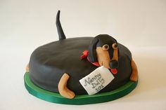 a birthday cake with a dog on it