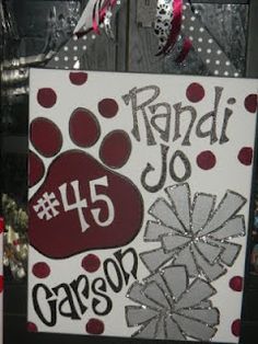 a sign that has been decorated with dog's paw prints and the number 15 on it