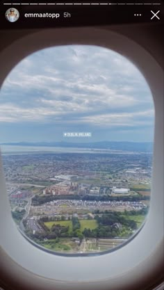 the view from an airplane window looking down on a city