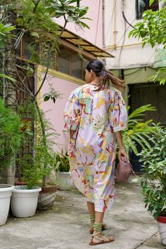 The Alula Kaftan in Eden Print is a stylish and versatile piece perfect for any occasion. The lower case design adds a modern touch to this traditional garment. Made with high-quality materials, this kaftan offers comfort and durability. Embrace your inner fashionista with this must-have addition to your wardrobe. Multicolor Cotton Kaftan For Spring, Spring Multicolor Cotton Kaftan, Multicolor Kaftan With Kimono Sleeves For Loungewear, Multicolor Tunic Kurta For Spring, Multicolor Kimono With Kimono Sleeves, Multicolor Long Sleeve Kaftan For Daywear, Multicolor Relaxed Fit Spring Kaftan, Spring Multicolor Relaxed Fit Kaftan, Spring Kaftan With Kimono Sleeves And Relaxed Fit