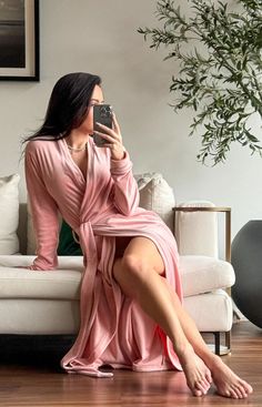 About This Robe: The So Blush Robe is an elegant and soft shade of pink. Our original Pink Sugar Short robe now in a long version. Details True to Size, does not run small Size up for a more relaxed fit Please try our Swan AI phone scan to find your ideal size under the color tabs Model is wearing size XS (Measurements: 5'3/115 lbs/(34DD/24/36) 95% Poly/5% Spandex Inside ties 54" long 2 Pockets Comes packaged in a beautiful pink satin bag Bedroom Robes, Fuzzy Robe, 115 Lbs, Shade Of Pink, Ideal Wardrobe, Satin Bags, Pink Sugar, Women's Robe, Pink Satin