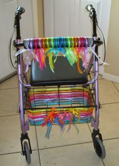 a multicolored rollator with lots of ribbons on it