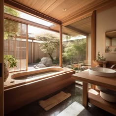 a bath room with a large tub and a wooden table in front of a window