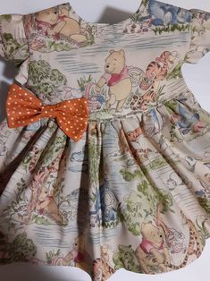 a dress with winnie the pooh on it