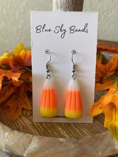 Charming Candy Corn Beaded Dangle Earrings for Halloween and Autumn | FREE SHIPPING! Celebrate Halloween in style with these Charming Candy Corn Beaded Dangle Earrings, designed to bring a sweet, playful touch to your autumn wardrobe. Perfect for Halloween parties, fall festivals, or adding a whimsical accent to any outfit, these earrings feature the classic tri-color candy corn design in vibrant yellow, orange, and white. They're the perfect accessory for standing out in any crowd! WHY YOU'LL L Hypoallergenic Dangle Earrings For Halloween, Multicolor Halloween Earrings For Gift, Multicolor Halloween Earrings Gift, Fun Halloween Dangle Earrings, Corn Design, Corn Bead, Spooky Candy, Candy Corn Earrings, Color Candy