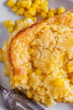 a piece of corn bread on a plate with a fork