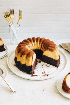 a bundt cake on a plate with one slice cut out