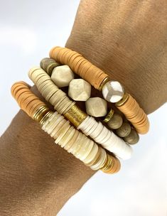 "This listing is for TWO bracelets (both are the pumpkin spice color). The bracelets are made with African clay discs, pearl chip beads and gold accent beads. My hand-beaded bracelets are made with stretch elastic which makes it comfortable and easy to wear. My bracelets are made to fit an average wrist size of 6.5\"-7\". Take a look around my shop for additional colors to add to your stack! The more the better! I've included pictures to give you an idea of bracelets to add to your set." Adjustable Orange Stackable Beaded Bracelets, Adjustable Stackable Orange Beaded Bracelets, Orange Stackable Bracelets With Round Beads, Stackable Orange Round Beaded Bracelets, Bohemian Gold Stretch Bracelet With Wooden Beads, Brown Stretch Bracelet With Stackable Round Beads, Brown Stackable Stretch Bracelet With Round Beads, Brown Stackable Bracelet With Round Beads, Adjustable Gold Stretch Bracelet With Wooden Beads