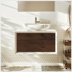 a bathroom sink sitting under a mirror next to a wall mounted faucet and wooden cabinet