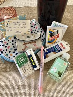 the contents of a personal care kit laid out on a table next to a jar