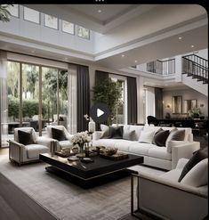 a living room filled with white furniture and lots of windows