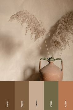 a vase with some plants in it and the colors are brown, green, beige