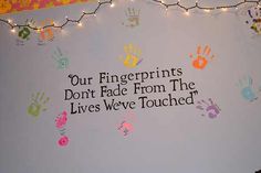 there is a sign that says our fingerprints don't fade from the lives we touched