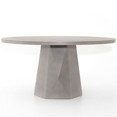 a round table made out of concrete on a white background