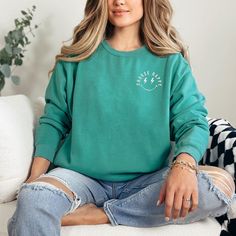 Looking for a cute versatile top to wear? Make sure to grab one of our Graphic Sweatshirts! This soft and comfortable shirt is the perfect top for any outfit. It can be paired with biker shorts, Jeans, or the classic stay at home sweats! This sweatshirt is true-to-size, so be sure to order your regular size! If you are looking for a more oversized look, make sure to size up. Acid Wash Crew Neck Tops, Acid Wash Crew Neck Comfortable Tops, Comfortable Acid Wash Crew Neck Top, Acid Wash Soft-washed Crew Top, Acid Wash Long Sleeve Casual T-shirt, Casual Acid Wash Long Sleeve T-shirt, Casual Long Sleeve Acid Wash T-shirt, Trendy Crew Soft-washed Tops, Trendy Soft-washed Crew Tops