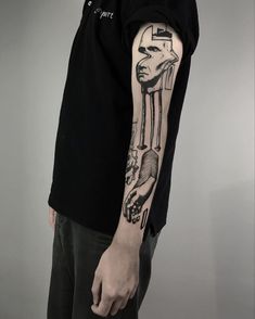 a man with a tattoo on his arm