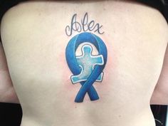 a woman with a blue ribbon tattoo on her back