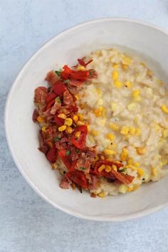 a white bowl filled with rice and corn