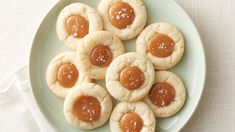 small cookies with peanut butter and jelly on a plate