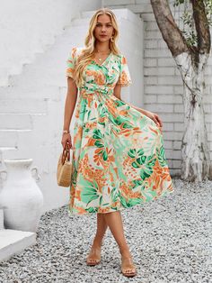 Make a statement with the Gemma Floral Midi Dress. Featuring a vibrant tropical print, this dress is perfect for adding a playful touch to any outfit. With a flattering midi length, it's sure to turn heads and keep you feeling confident all day long. Say aloha to your new go-to vacation dress! Size Guide: Tina is 5’65” tall, and has a 33.6” bust, 24.1” waist, & 35.2” hips. She is wearing a S / US 4 / AU 8. This dress is true to size. Material: 100% Polyester. Feature: V-neckline. Midi length. Short Sleeve. Relax fit. Care Instructions: Machine wash / Cold hand wash Vacation Dress, Feeling Confident, Vacation Dresses, Floral Midi Dress, Tropical Print, Midi Length, Size Guide, Care Instructions, Hand Wash