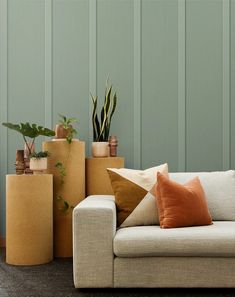 a living room filled with lots of different types of pillows