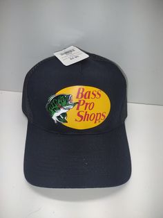 Vintage Bass Pro Shops Fish Mesh Trucker Black Fishing Hat Cap Snapback NWT. Brand new with the tags. The inside tag says Bass pro shops national headquarters in Springfield missouri. This is got to be from the early 90s as the original price tag is still on it of $2.95 Casual Short Brim Baseball Cap For Fishing, Black Curved Brim Fishing Hat, Adjustable Black Fishing Hat, Adjustable Black Hat For Fishing, Black Casual Snapback Hat For Fishing, Black Curved Brim Hat For Fishing, Adjustable Black Trucker Hat For Fishing, Black Snapback Hat For Fishing, One Size Fits Most Snapback Fishing Cap