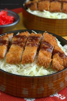 some food is in a wooden bowl on a red and white table cloth next to other dishes