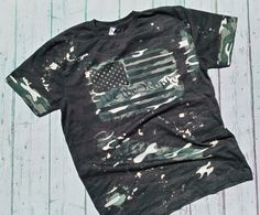 American Flag Green Camo T-Shirt - Bleached Shirt - USA -Flag - Bleached Women's Shirt - Bleached Camo T-Shirt - Green Camo Shirt Bleach style and pattern may vary *Shirt Details* 4.5 oz., 60/40 poly/cotton Ribbed collar Shoulder-to-shoulder self-fabric back neck tape Double needle sleeves and bottom hem Side seam construction EasyTear™ label Machine washable/ tumble dry low Fit: Adult Unisex - True to Size *Sizes* S M L XL XXL Shirt will be made as shown Ripped Shirts, Bleached Shirt, Camo Shirt, Distressed Shirt, Leopard Print Shirt, Hippie Shirt, We The People, Sublime Shirt, Camo Shirts