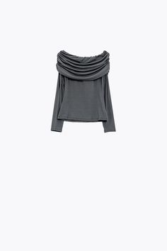 Introducing our Bodycon Off-Shoulder Top in a stunning grey hue, a versatile and flattering piece that transcends every season. This off-shoulder top features a romantic Bardot neckline, long sleeves, and a bodycon fit, creating a chic and stylish silhouette.  The ruched details on the top not only add a touch of flair but also contribute to a flattering and tailored look, making it perfect for everyone. Crafted from lightweight woven fabric, the top offers comfort and breathability, ensuring it's suitable for various occasions.  The 95% Viscose and 5% Elastane composition adds a soft and stretchy feel to the fabric, enhancing both comfort and style. Whether you're dressing up for a special occasion or seeking a trendy everyday look, this off-shoulder top is a perfect choice.  Our model, s Tan Scarf, Off Shoulder Top, Scarf Hat, Spring Wardrobe, Boat Neckline, Off The Shoulder Top, Jeans Jumpsuit, Off Shoulder Tops, Hat Hairstyles