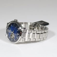 Item No. RA-AG0028L10G ﻿Orient Classic Blue Dial Automatic Stainless Steel Men's Watch RA-AG0028L10B ﻿Watch Features: Automatic Movement Caliber: F6T22 22 Jewels Stainless Steel Case Stainless Steel Bracelet Blue Dial Analog Display Open Heart Display Screw Down Crown Exhibition Case Back Water Resistance: 30 Meters Case Diameter: 40 mm Case Thickness: 12 mm Mineral Crystal Deployment Clasp Free Priority Shipping on all orders in continental U.S. Shipping time is usually between 2 and 6 day's. 1 Classic Blue, Blue Bracelet, Minerals Crystals, Stainless Steel Bracelet, Omega Watch, Stainless Steel Case, Bracelet Watch, Stainless Steel, Crystals