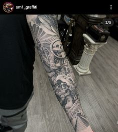 a man's arm with tattoos on it and an image of skulls in the background