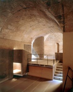 an empty room with some stairs leading up to it